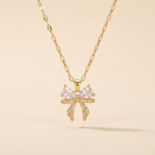 Collier Pendentif Nœud Doré, collier en acier doré Maison Orena — vue de face