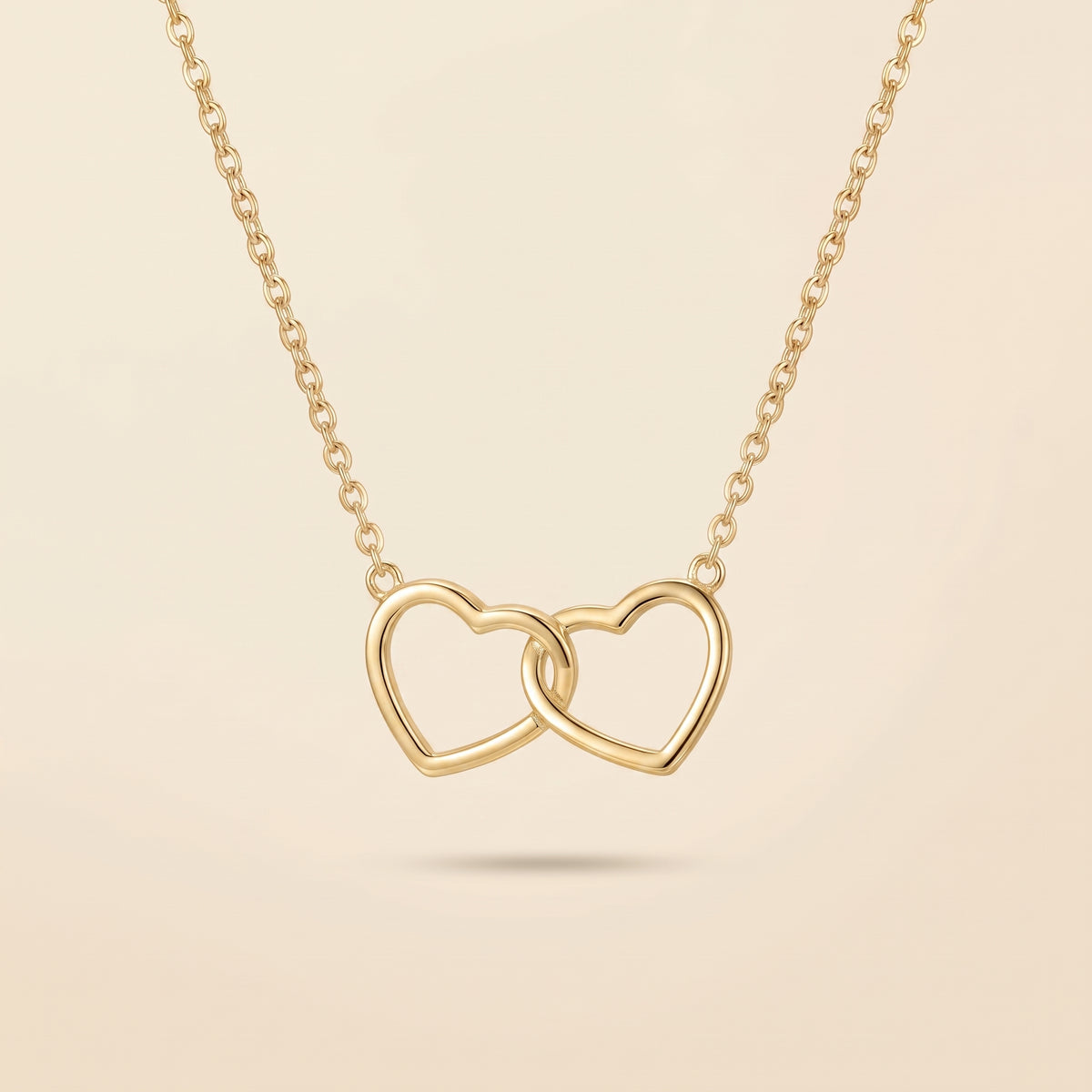 Collier Double Cœur Entrelacé Doré, collier en acier doré Maison Orena — vue de face